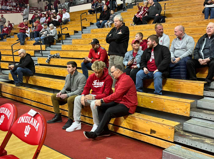 Indiana football offensive coordinator Walt Bell (left), quarterback recruit Tayven Jackson (middle) and head coach Tom Allen (right) talk before the Indiana versus Wisconsin basketball game on Saturday, Jan. 14 at Simon Skjodt Assembly Hall in Bloomington, Ind.